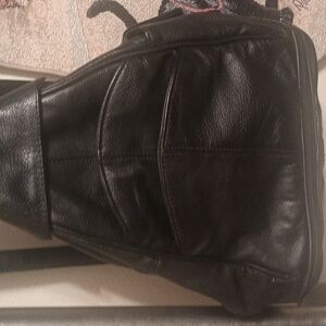 A Black Leather Backpack By Transetter